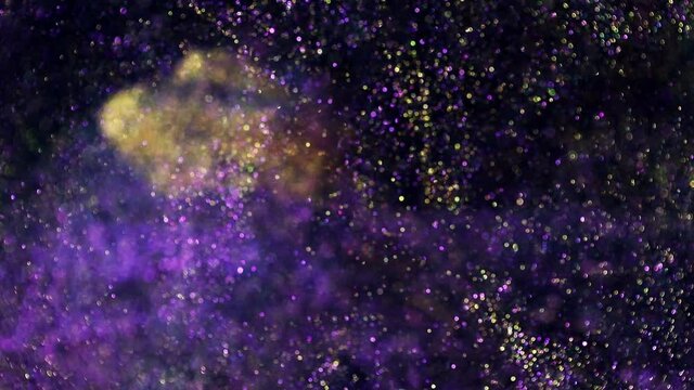 Festive twinkle glitters background video. Abstract glowing backdrop with circles in motion. Footage with flickering liquid particles. Colorful and vivid fluent animation with blur effect