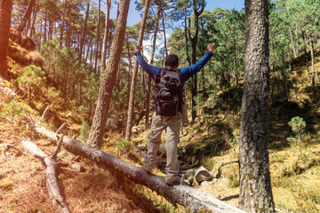 Shallow focus of male hikers with backpacks hiking through the forests of Iztaccihuatl, Mexico