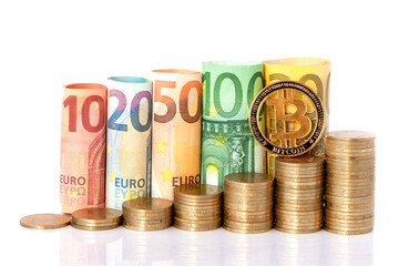 Bitcoin and Ten, twenty, fifty, one hundred, two hundred and coins euro rolled bills banknotes on white background. Histogram from the euro. Concept of currency growth, savings.
