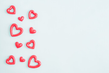 Valentines day composition with red hearts on a light background