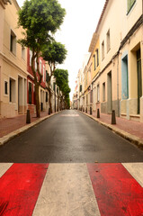 Fototapeta na wymiar Crossing path on street in Menorca