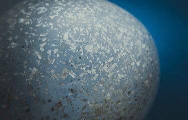 Abstract background texture, bright holographic shaped metal foil ornament inside the balloon.