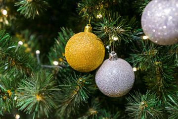Christmas background. Christmas tree branches, gift, balls and stars