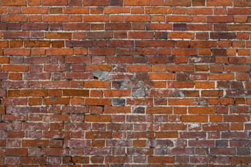 brick red wall. background of a old brick house.