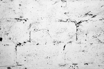 Texture of a brick wall with cracks and scratches which can be used as a background