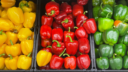 yellow red and green paprika at the market