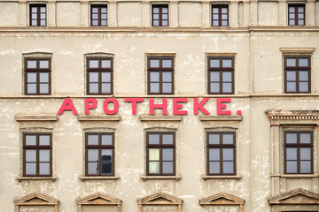 Inscription Pharmacy on facade of old house in historic downtown, Gorlitz (Görlitz),  Germany