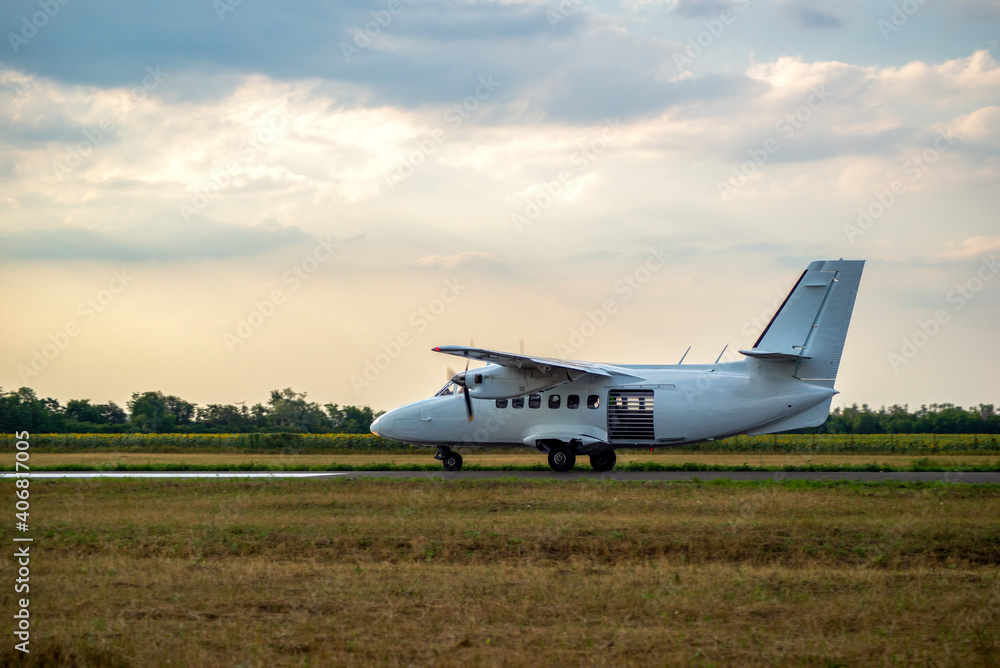 Wall mural small propeller plane at the airport