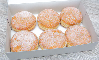 Box of Delicious donuts with Icing Sugar