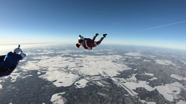 Skydiving. Fun jump. Two skydivers are having fun in the sky.