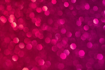 Abstract red and pink glitter lights background. Circle blurred bokeh. Romantic backdrop for Valentines day, womens day, holiday or event