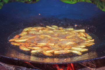 Fried potatoes on the grill