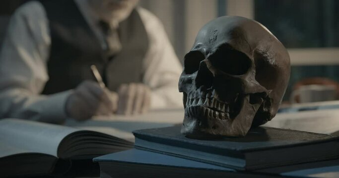 Academic professor studying a human skull