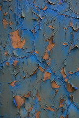 Obraz premium Rough textured blue wall with stains, selective focus