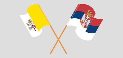 Crossed flags of Vatican and Serbia