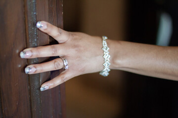 A bride shows off her wedding ring. 
