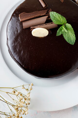 Chocolate cake with mint leaves