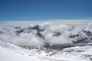 Snowy slope below Zugspitze Top of Germany in summer sunny blue sky