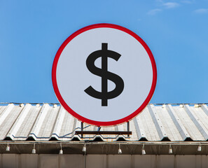 A Circle billboard with icon a symbol of dollar, is installed on a roof. Board with sign of...