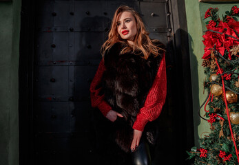 Elegant girl walk in a winter city. Beautiful lady with blond hair. Portrait of beautiful blond...