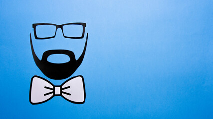 Silhouettes of a man with a bow tie. Father's day concept. Cenital  shot with copy space. Father's day concept