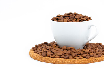 A cup of coffee beans isolated on a white background.
