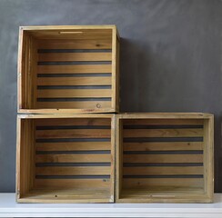 empty wooden boxes on a gray background