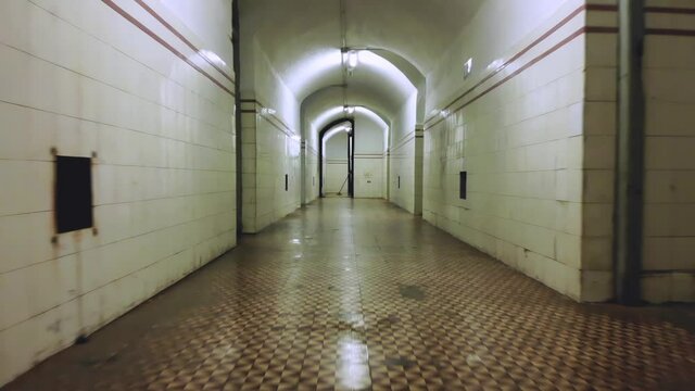 Civil War Bunker Hall. Reverse steady cam motion with person cleaning in the background