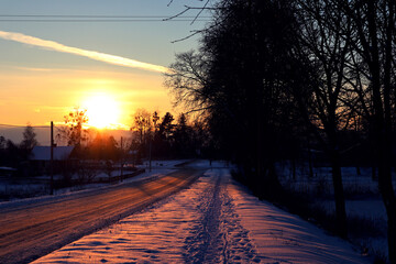 Winter evening in the village, landscape