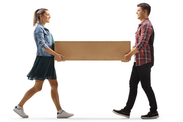 Young man and woman carrying a cardboard box