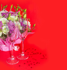 Background of Valentines day celebration with champagne glassses, flowers boucket, hearts glitter.