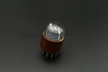 old radio tube on a black background