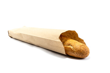 Appetizing baguette in a paper bag on a white background