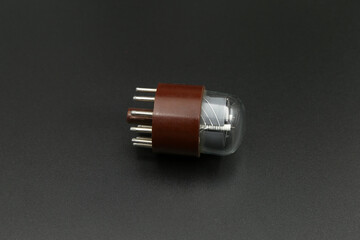 old radio tube on a black background