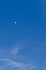 Day with the blue sky and the moon
