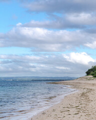 view of the beach with gray clouds