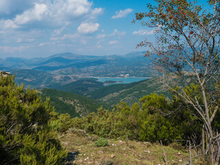 view of the National Park of Barbagia with blue lake lago Alto del Flumendosa, limestone rocks,...