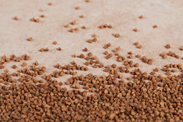 Buckwheat groats close up. Grains of raw buckwheat as a abstract background texture.