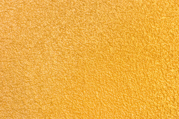 Abstract gold stucco wall texture, plaster yellow pattern background