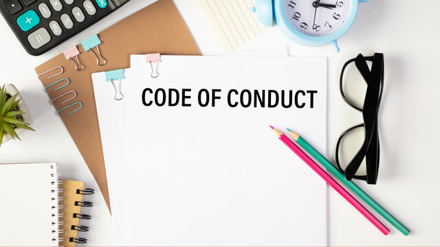 Code of Conduct Text written on notebook page, red pencil on the right. Motivational Concept image