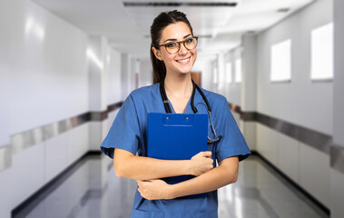 Nurse portrait smiling in a hospital hallway