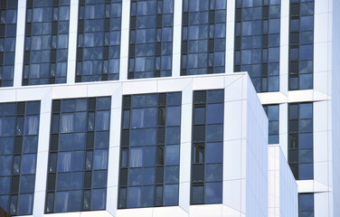 tall white modern apartment buildings with dark windows