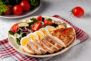 Grilled chicken fillet with fresh vegetable salad