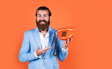 Great service matters. brutal bearded man hold vintage telephone. concept of technology in modern life. communication. idea of conversation. man speak on phone. happy man with retro phone