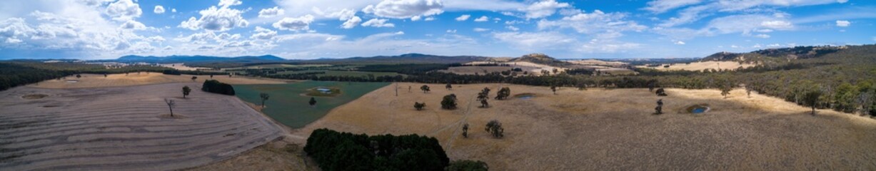 Fototapeta na wymiar Wide aerial panorama fo scenic fields and hills in Victoria, Australia