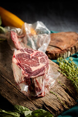 Steak the Tomahawk rests on a vacuum packed
