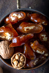 Churchkhela Pestil or Walnut Fruit Pulp in bowl on dark background.