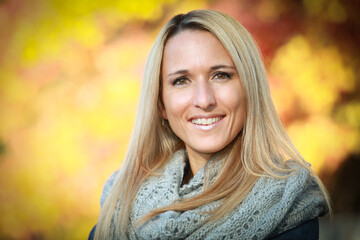 Portrait Of A Mature Woman Smiling At The Camera. Fall. Autumn.	