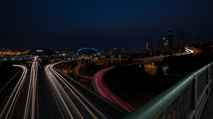 Fototapeta na wymiar Seattle cityscape at night from the Jose Rizal Bridge, with car trails.