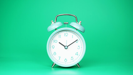 Alarm clock 10.10 o'clock isolated on green background, Copy space for your text, Time concept.